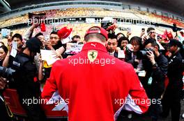 Kimi Raikkonen (FIN) Ferrari signs autographs for the fans. 12.04.2018. Formula 1 World Championship, Rd 3, Chinese Grand Prix, Shanghai, China, Preparation Day.