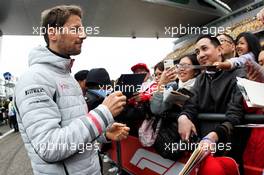 Romain Grosjean (FRA) Haas F1 Team signs autographs for the fans. 12.04.2018. Formula 1 World Championship, Rd 3, Chinese Grand Prix, Shanghai, China, Preparation Day.