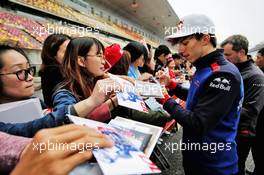 Pierre Gasly (FRA) Scuderia Toro Rosso signs autographs for the fans. 12.04.2018. Formula 1 World Championship, Rd 3, Chinese Grand Prix, Shanghai, China, Preparation Day.