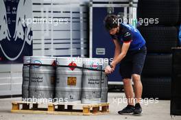 Scuderia Toro Rosso mechanic with Esso fuel churns. 12.04.2018. Formula 1 World Championship, Rd 3, Chinese Grand Prix, Shanghai, China, Preparation Day.
