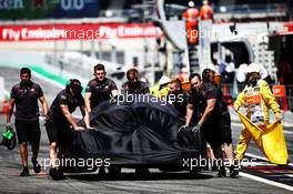 The Haas VF-18 of Romain Grosjean (FRA) Haas F1 Team is recovered back to the pits in the second practice session. 11.05.2018. Formula 1 World Championship, Rd 5, Spanish Grand Prix, Barcelona, Spain, Practice Day.