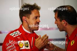 (L to R): Sebastian Vettel (GER) Ferrari with Marc Gene (ESP) Ferrari Test Driver. 11.05.2018. Formula 1 World Championship, Rd 5, Spanish Grand Prix, Barcelona, Spain, Practice Day.