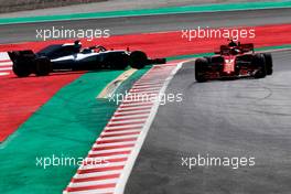 Valtteri Bottas (FIN) Mercedes AMG F1 W09 spins in the first practice session, and is passed by Kimi Raikkonen (FIN) Ferrari SF71H. 11.05.2018. Formula 1 World Championship, Rd 5, Spanish Grand Prix, Barcelona, Spain, Practice Day.
