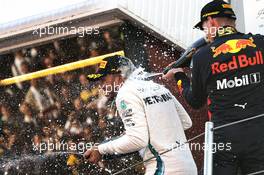 Race winner Lewis Hamilton (GBR) Mercedes AMG F1 celebrates with the champagne on the podium with Max Verstappen (NLD) Red Bull Racing. 13.05.2018. Formula 1 World Championship, Rd 5, Spanish Grand Prix, Barcelona, Spain, Race Day.