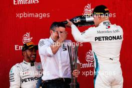 (L to R): Race winner Lewis Hamilton (GBR) Mercedes AMG F1 celebrates on the podium with Peter Bonnington (GBR) Mercedes AMG F1 Race Engineer and Valtteri Bottas (FIN) Mercedes AMG F1. 13.05.2018. Formula 1 World Championship, Rd 5, Spanish Grand Prix, Barcelona, Spain, Race Day.