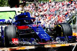 The damaged Scuderia Toro Rosso STR13 of Pierre Gasly (FRA) Scuderia Toro Rosso is recovered back to the pits on the back of a truck. 13.05.2018. Formula 1 World Championship, Rd 5, Spanish Grand Prix, Barcelona, Spain, Race Day.