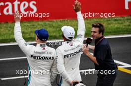 Lewis Hamilton (GBR) Mercedes AMG F1 (Centre) celebrates his pole position in qualifying parc ferme with second placed team mate Valtteri Bottas (FIN) Mercedes AMG F1. 12.05.2018. Formula 1 World Championship, Rd 5, Spanish Grand Prix, Barcelona, Spain, Qualifying Day.