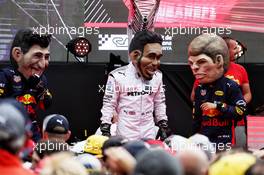 (L to R): Daniel Ricciardo (AUS) Red Bull Racing; Lewis Hamilton (GBR) Mercedes AMG F1; and Max Verstappen (NLD) Red Bull Racing caricatures in the Fanzone. 12.05.2018. Formula 1 World Championship, Rd 5, Spanish Grand Prix, Barcelona, Spain, Qualifying Day.