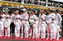 Esteban Ocon (FRA) Sahara Force India F1 Team and Sergio Perez (MEX) Sahara Force India F1 as the grid observes the national anthem. 24.06.2018. Formula 1 World Championship, Rd 8, French Grand Prix, Paul Ricard, France, Race Day.