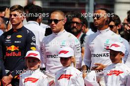 (L to R): Max Verstappen (NLD) Red Bull Racing; Valtteri Bottas (FIN) Mercedes AMG F1; and Lewis Hamilton (GBR) Mercedes AMG F1, as the grid observes the national anthem. 24.06.2018. Formula 1 World Championship, Rd 8, French Grand Prix, Paul Ricard, France, Race Day.