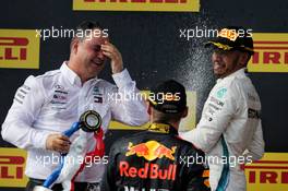 Race winner Lewis Hamilton (GBR) Mercedes AMG F1 celebrates on the podium with Ron Meadows (GBR) Mercedes GP Team Manager and Max Verstappen (NLD) Red Bull Racing. 24.06.2018. Formula 1 World Championship, Rd 8, French Grand Prix, Paul Ricard, France, Race Day.