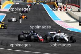 Romain Grosjean (FRA) Haas F1 Team VF-18 and Charles Leclerc (MON) Sauber F1 Team C37 battle for position. 24.06.2018. Formula 1 World Championship, Rd 8, French Grand Prix, Paul Ricard, France, Race Day.