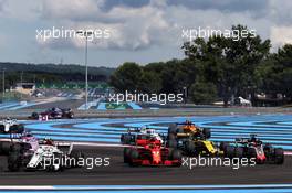 (L to R): Charles Leclerc (MON) Sauber F1 Team C37, Kimi Raikkonen (FIN) Ferrari SF71H, and Romain Grosjean (FRA) Haas F1 Team VF-18, at the start of the race. 24.06.2018. Formula 1 World Championship, Rd 8, French Grand Prix, Paul Ricard, France, Race Day.