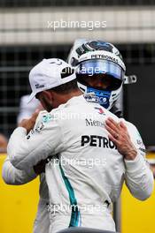 Lewis Hamilton (GBR) Mercedes AMG F1 celebrates his pole position in qualifying parc ferme with second placed team mate Valtteri Bottas (FIN) Mercedes AMG F1. 23.06.2018. Formula 1 World Championship, Rd 8, French Grand Prix, Paul Ricard, France, Qualifying Day.