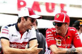 (L to R): Charles Leclerc (MON) Sauber F1 Team and Kimi Raikkonen (FIN) Ferrari on the drivers parade. 24.06.2018. Formula 1 World Championship, Rd 8, French Grand Prix, Paul Ricard, France, Race Day.