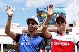 (L to R): Pierre Gasly (FRA) Scuderia Toro Rosso and Charles Leclerc (MON) Sauber F1 Team on the drivers parade. 24.06.2018. Formula 1 World Championship, Rd 8, French Grand Prix, Paul Ricard, France, Race Day.