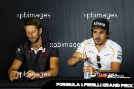 (L to R): Romain Grosjean (FRA) Haas F1 Team with Fernando Alonso (ESP) McLaren in the FIA Press Conference. 21.06.2018. Formula 1 World Championship, Rd 8, French Grand Prix, Paul Ricard, France, Preparation Day.