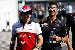 (L to R): Charles Leclerc (MON) Sauber F1 Team with Daniel Ricciardo (AUS) Red Bull Racing. 06.07.2018. Formula 1 World Championship, Rd 10, British Grand Prix, Silverstone, England, Practice Day.