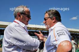(L to R): Jerome Stoll (FRA) Renault Sport F1 President with Zak Brown (USA) McLaren Executive Director on the grid. 08.07.2018. Formula 1 World Championship, Rd 10, British Grand Prix, Silverstone, England, Race Day.