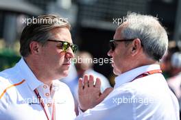 (L to R): Zak Brown (USA) McLaren Executive Director with Jerome Stoll (FRA) Renault Sport F1 President on the grid. 08.07.2018. Formula 1 World Championship, Rd 10, British Grand Prix, Silverstone, England, Race Day.