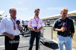(L to R): Martin Brundle (GBR) Sky Sports Commentator with Jenson Button (GBR) and Simon Lazenby (GBR) Sky Sports F1 TV Presenter on the grid. 08.07.2018. Formula 1 World Championship, Rd 10, British Grand Prix, Silverstone, England, Race Day.