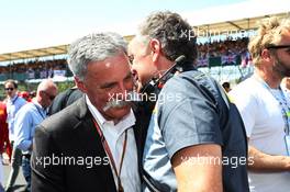 (L to R): Chase Carey (USA) Formula One Group Chairman with Mario Isola (ITA) Pirelli Racing Manager on the grid. 08.07.2018. Formula 1 World Championship, Rd 10, British Grand Prix, Silverstone, England, Race Day.