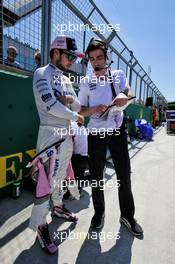 Sergio Perez (MEX) Sahara Force India F1 with Tim Wright (GBR) Sahara Force India F1 Team Race Engineer on the grid. 08.07.2018. Formula 1 World Championship, Rd 10, British Grand Prix, Silverstone, England, Race Day.
