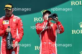 Kimi Raikkonen (FIN) Ferrari celebrates his third position on the podium with team mate Sebastian Vettel (GER) Ferrari (Left). 08.07.2018. Formula 1 World Championship, Rd 10, British Grand Prix, Silverstone, England, Race Day.