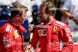 (L to R): Kimi Raikkonen (FIN) Ferrari with team mate and race winner Sebastian Vettel (GER) Ferrari in parc ferme. 08.07.2018. Formula 1 World Championship, Rd 10, British Grand Prix, Silverstone, England, Race Day.
