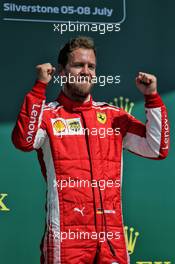 Race winner Sebastian Vettel (GER) Ferrari celebrates on the podium. 08.07.2018. Formula 1 World Championship, Rd 10, British Grand Prix, Silverstone, England, Race Day.
