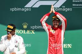 The podium (L to R): Lewis Hamilton (GBR) Mercedes AMG F1 on the podium with race winner Sebastian Vettel (GER) Ferrari. 08.07.2018. Formula 1 World Championship, Rd 10, British Grand Prix, Silverstone, England, Race Day.