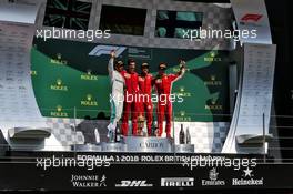 The podium (L to R): Lewis Hamilton (GBR) Mercedes AMG F1, second; Claudio Albertini (ITA) Ferrari; Sebastian Vettel (GER) Ferrari, race winner; Kimi Raikkonen (FIN) Ferrari, third. 08.07.2018. Formula 1 World Championship, Rd 10, British Grand Prix, Silverstone, England, Race Day.
