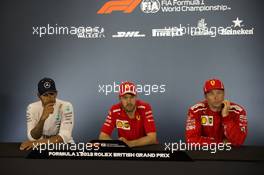 The post race FIA Press Conference (L to R): Lewis Hamilton (GBR) Mercedes AMG F1, second; Sebastian Vettel (GER) Ferrari, race winner; Kimi Raikkonen (FIN) Ferrari, third. 08.07.2018. Formula 1 World Championship, Rd 10, British Grand Prix, Silverstone, England, Race Day.