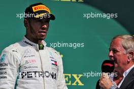 Lewis Hamilton (GBR) Mercedes AMG F1 on the podium with Martin Brundle (GBR) Sky Sports Commentator. 08.07.2018. Formula 1 World Championship, Rd 10, British Grand Prix, Silverstone, England, Race Day.
