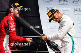 The podium (L to R): Race winner Sebastian Vettel (GER) Ferrari celebrates with  second placed Lewis Hamilton (GBR) Mercedes AMG F1. 08.07.2018. Formula 1 World Championship, Rd 10, British Grand Prix, Silverstone, England, Race Day.