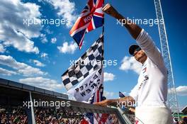 Lewis Hamilton (GBR) Mercedes AMG F1 celebrates with the fans. 08.07.2018. Formula 1 World Championship, Rd 10, British Grand Prix, Silverstone, England, Race Day.