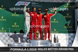 The podium (L to R): Lewis Hamilton (GBR) Mercedes AMG F1, second; Claudio Albertini (ITA) Ferrari; Sebastian Vettel (GER) Ferrari, race winner; Kimi Raikkonen (FIN) Ferrari, third. 08.07.2018. Formula 1 World Championship, Rd 10, British Grand Prix, Silverstone, England, Race Day.