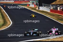 Lewis Hamilton (GBR) Mercedes AMG F1 W09 and Esteban Ocon (FRA) Sahara Force India F1 VJM11 battle for position. 08.07.2018. Formula 1 World Championship, Rd 10, British Grand Prix, Silverstone, England, Race Day.