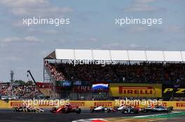 Lewis Hamilton (GBR) Mercedes AMG F1 W09 and Kimi Raikkonen (FIN) Ferrari SF71H make contact at the start of the race. 08.07.2018. Formula 1 World Championship, Rd 10, British Grand Prix, Silverstone, England, Race Day.