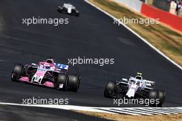 (L to R): Sergio Perez (MEX) Sahara Force India F1 VJM11 and Sergey Sirotkin (RUS) Williams FW41 battle for position. 08.07.2018. Formula 1 World Championship, Rd 10, British Grand Prix, Silverstone, England, Race Day.