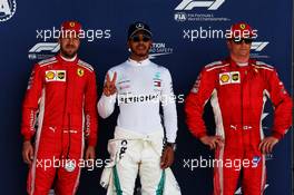 Qualifying top three in parc ferme (L to R): Sebastian Vettel (GER) Ferrari, second; Lewis Hamilton (GBR) Mercedes AMG F1, pole position; Kimi Raikkonen (FIN) Ferrari, third. 07.07.2018. Formula 1 World Championship, Rd 10, British Grand Prix, Silverstone, England, Qualifying Day.