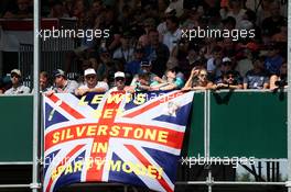 Lewis Hamilton (GBR) Mercedes AMG F1 fans in the grandstand and a flag. 07.07.2018. Formula 1 World Championship, Rd 10, British Grand Prix, Silverstone, England, Qualifying Day.