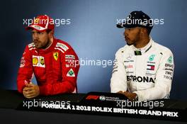 (L to R): Sebastian Vettel (GER) Ferrari and Lewis Hamilton (GBR) Mercedes AMG F1 in the FIA Press Conference. 07.07.2018. Formula 1 World Championship, Rd 10, British Grand Prix, Silverstone, England, Qualifying Day.