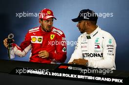 (L to R): Sebastian Vettel (GER) Ferrari with Lewis Hamilton (GBR) Mercedes AMG F1 in the FIA Press Conference. 07.07.2018. Formula 1 World Championship, Rd 10, British Grand Prix, Silverstone, England, Qualifying Day.