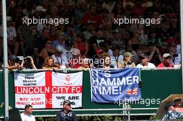 Lewis Hamilton (GBR) Mercedes AMG F1 fans and Lincoln City FC fans in the grandstand. 07.07.2018. Formula 1 World Championship, Rd 10, British Grand Prix, Silverstone, England, Qualifying Day.