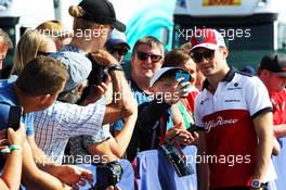 Charles Leclerc (MON) Sauber F1 Team with fans. 08.07.2018. Formula 1 World Championship, Rd 10, British Grand Prix, Silverstone, England, Race Day.
