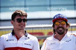 (L to R): Charles Leclerc (MON) Sauber F1 Team with Fernando Alonso (ESP) McLaren on the drivers parade. 08.07.2018. Formula 1 World Championship, Rd 10, British Grand Prix, Silverstone, England, Race Day.