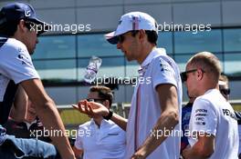 (L to R): Lance Stroll (CDN) Williams with Esteban Ocon (FRA) Sahara Force India F1 Team on the drivers parade. 08.07.2018. Formula 1 World Championship, Rd 10, British Grand Prix, Silverstone, England, Race Day.