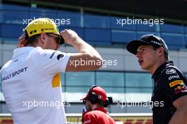 (L to R): Nico Hulkenberg (GER) Renault Sport F1 Team with Max Verstappen (NLD) Red Bull Racing on the drivers parade. 08.07.2018. Formula 1 World Championship, Rd 10, British Grand Prix, Silverstone, England, Race Day.
