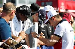 Charles Leclerc (MON) Sauber F1 Team signs autographs for the fans. 08.07.2018. Formula 1 World Championship, Rd 10, British Grand Prix, Silverstone, England, Race Day.